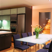 view of the dining and kitchen area featuring ceiling, countertop, interior design, kitchen, living room, room, wall, brown, orange