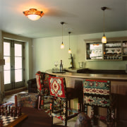 view of the bar where the hanging lights dining room, furniture, home, interior design, kitchen, room, table, brown