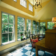 A view of a dining area, yellow walls, daylighting, dining room, estate, home, house, interior design, living room, porch, real estate, room, window, brown