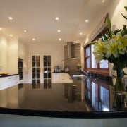 Kitchen with reflective black granite benchtops, light coloured ceiling, countertop, interior design, kitchen, property, real estate, room, brown