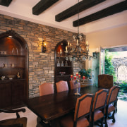 view of the masonry wall showing archway shelving ceiling, dining room, home, interior design, living room, real estate, room, table, wall, black