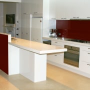 View of kitchen with light coloured stone benchtops, cabinetry, countertop, cuisine classique, floor, furniture, kitchen, product design, room, white