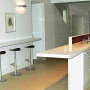 View of kitchen with light coloured stone benchtops, countertop, floor, flooring, furniture, interior design, kitchen, product design, property, room, sink, table, white, gray