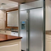 view of this side by side samsung refrigerator cabinetry, countertop, home appliance, kitchen, kitchen appliance, major appliance, refrigerator, room, gray