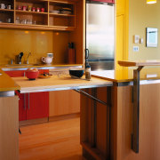 A view of the kitchen, wooden flooring and cabinetry, countertop, cuisine classique, floor, flooring, furniture, hardwood, interior design, kitchen, room, table, wood, wood flooring, brown