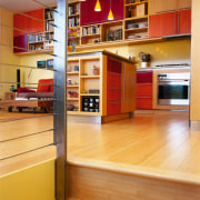 A view of the kitchen area from the bookcase, cabinetry, floor, flooring, furniture, hardwood, interior design, kitchen, shelf, shelving, wood, wood flooring, orange, brown