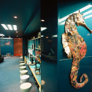 Room with shiny blue walls, seahorse sculpture on interior design, tourist attraction, teal, black