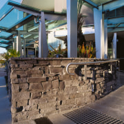 View of entranceway to Coro Hotel, featuring stone wall, black