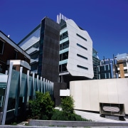 Exterior view of research centre showing concrete end apartment, architecture, building, city, commercial building, condominium, corporate headquarters, daytime, facade, headquarters, house, metropolis, metropolitan area, mixed use, neighbourhood, property, real estate, residential area, sky, blue, black