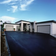 view of this house featuring palliside traditonal weatherboard architecture, asphalt, building, cloud, elevation, estate, facade, home, house, property, real estate, residential area, roof, siding, sky, blue, teal