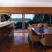 the new open-plan kitchen and dining area featuring floor, flooring, furniture, hardwood, house, interior design, living room, real estate, room, table, window, wood, wood flooring