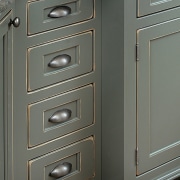 view of this kicthen cabinet where touches of cabinetry, chest of drawers, drawer, furniture, wood stain, gray