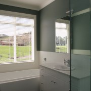 A view of the bathroom, dark grey walls, bathroom, bathroom accessory, bathroom cabinet, home, interior design, real estate, room, window, window covering, window treatment, gray, black