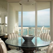 view of the casual dining area looking out dining room, furniture, home, interior design, living room, real estate, room, table, window, window covering, window treatment, gray