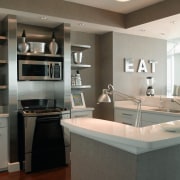 view of the kitchen featuring cambria countertops, and cabinetry, countertop, cuisine classique, interior design, kitchen, gray, black