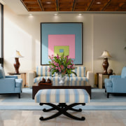 view of sthe lobby featuring pale blue furniture ceiling, furniture, interior design, living room, lobby, room, table, wall, gray