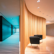 A view of the reception area, wooden flooring architecture, ceiling, daylighting, floor, flooring, hardwood, house, interior design, light, lighting, lobby, product design, wall, wood, wood flooring, orange