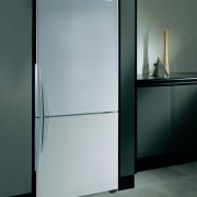 Refrigerator set into kitchen cabinetry. - Refrigerator set door, glass, product design, gray