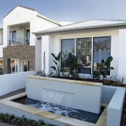 Aview of the cream tiled and white plastered architecture, elevation, estate, facade, home, house, property, real estate, residential area, villa, window, gray
