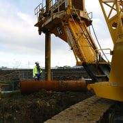 Large drilling and piling equipment for bridge. - construction, construction equipment, crane, black, white, brown