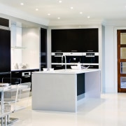 A view of the kitcyhen area, cream tiled cabinetry, countertop, cuisine classique, floor, flooring, furniture, interior design, kitchen, room, shelving, white, gray