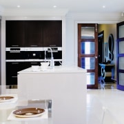 A view of the kitcyhen area, cream tiled interior design, kitchen, living room, room, white