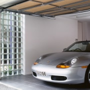 view of this garage featuring a garage window automotive design, automotive exterior, car, garage, material, motor vehicle, porsche, sports car, technology, vehicle, vehicle door, window, gray