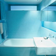 View of bath and faucetry in the bathroom. aqua, azure, bathroom, bathroom sink, bathtub, blue, floor, interior design, plumbing fixture, product, product design, purple, room, sink, tap, tile, toilet seat, turquoise, teal