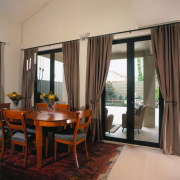 view of the dining area that opens out curtain, dining room, door, interior design, living room, real estate, room, window, window covering, window treatment, orange, black