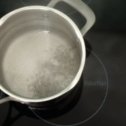 A view of a pot on the glass boiling, cookware and bakeware, black, gray