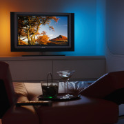 the phillips ambilight 2 technology provides ambient colour display device, entertainment, flat panel display, furniture, home, interior design, lighting, living room, multimedia, room, television, black