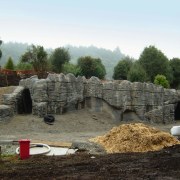 A view of some engineering work within a archaeological site, rock, stone wall, wall, white, black