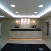 A view of the reception area. - A ceiling, daylighting, floor, flooring, interior design, lighting, lobby, gray