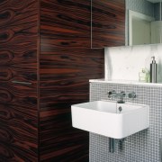 A view of a bathroom, tiled walls, wooden bathroom, bathroom accessory, bathroom cabinet, ceramic, floor, flooring, interior design, product, product design, tap, tile, wall, black