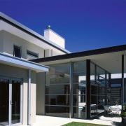 Exterior view of outside seated area as well architecture, building, daylighting, elevation, facade, home, house, property, real estate, residential area, roof, sky, window, blue, black