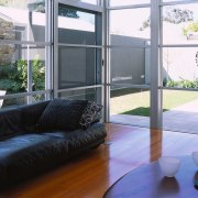 Interior view of the living area as well architecture, balcony, daylighting, floor, home, house, interior design, living room, property, real estate, window