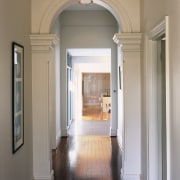 Interior view of the hallway. - Interior view architecture, ceiling, column, door, estate, floor, flooring, hall, hardwood, home, house, interior design, molding, real estate, structure, wall, window, gray