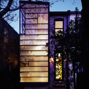 Architect David Jameson modern insertion into this row architecture, building, facade, glass, home, house, landscape lighting, light, lighting, purple, reflection, window, black