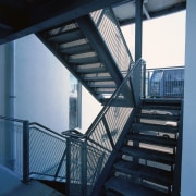 An exterior view of the steel used on architecture, building, daylighting, glass, handrail, stairs, steel, structure, window, black, teal