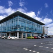 A view of the Jalcon homes building. - architecture, building, commercial building, condominium, convention center, corporate headquarters, daytime, facade, headquarters, metropolitan area, mixed use, real estate, sky, blue