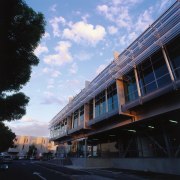 An exterior view of the Zone23 building. - architecture, building, city, condominium, downtown, facade, house, infrastructure, metropolis, metropolitan area, mixed use, neighbourhood, real estate, residential area, road, sky, town, tree, black, teal