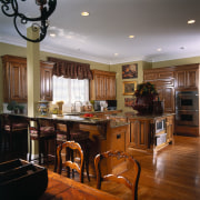 A view of the kitchen area, wooden flooring cabinetry, ceiling, countertop, cuisine classique, flooring, hardwood, home, interior design, kitchen, room, wood, wood flooring, brown, gray