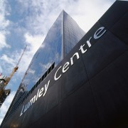 A view of the signage placed about the architecture, building, daytime, sky, structure, black, white