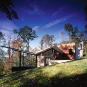 An exterior view of the entire house. - architecture, cloud, cottage, estate, farmhouse, grass, home, house, landscape, nature, plant, property, real estate, rural area, sky, sunlight, tree, blue, black