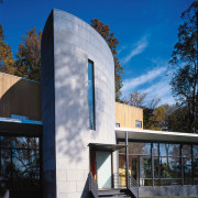 An exterior view of the house. - An architecture, building, corporate headquarters, daytime, facade, home, house, real estate, sky, blue, black