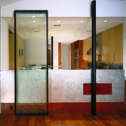 A view of the dividing wall between the architecture, ceiling, door, floor, flooring, glass, interior design, lobby, wall, gray