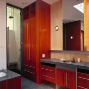 A view of the bathroom, tiled floor, wooden bathroom, bathroom cabinet, cabinetry, countertop, floor, interior design, kitchen, room, red, gray