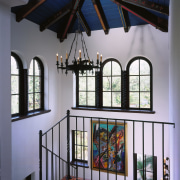 A dominant structure within the home, the staircase ceiling, daylighting, estate, glass, handrail, home, interior design, iron, window, gray, black