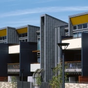 A exterior view of the material used on apartment, architecture, building, commercial building, condominium, corporate headquarters, elevation, facade, home, house, mixed use, neighbourhood, property, real estate, residential area, black