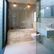 A view of a bathroom, tiled floor and architecture, bathroom, daylighting, floor, glass, interior design, room, tile, gray